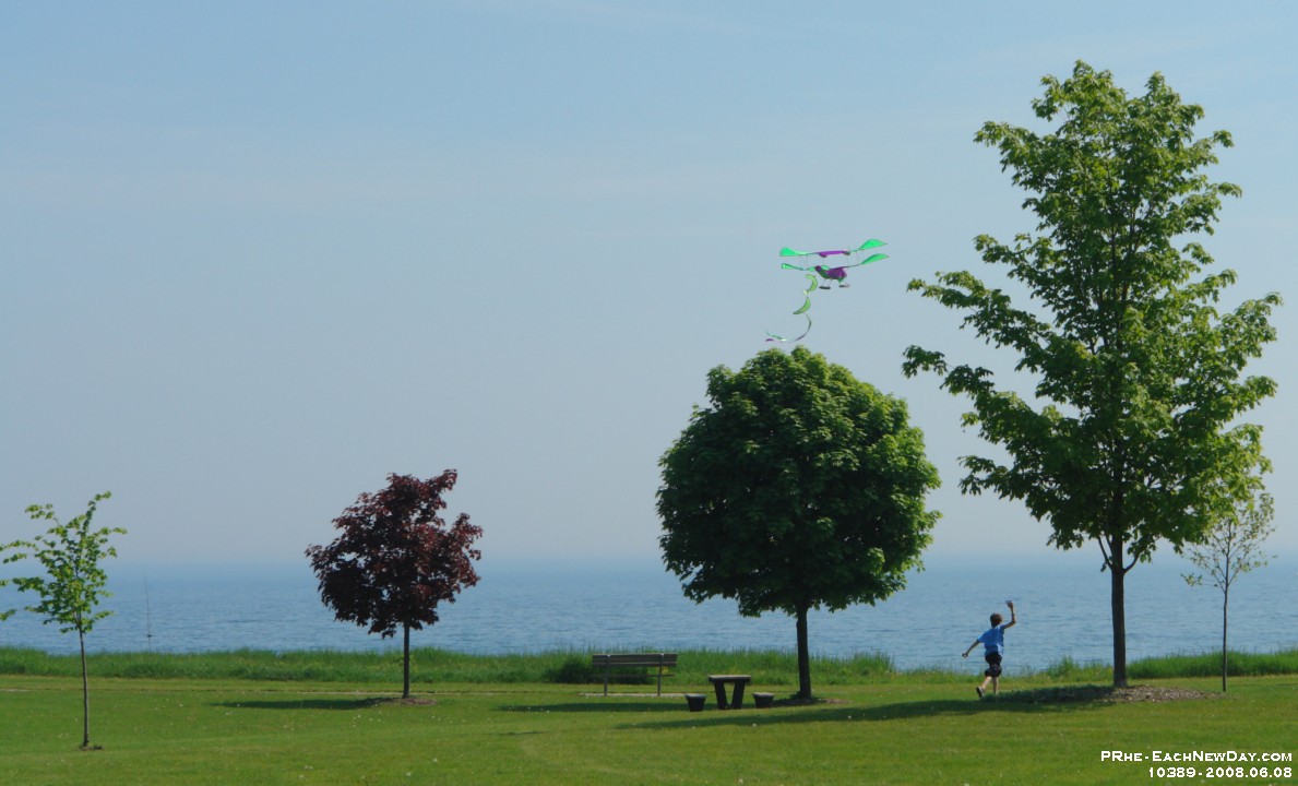 10389CrLe - Flying the airplane kite with Andrew at Rotary Park